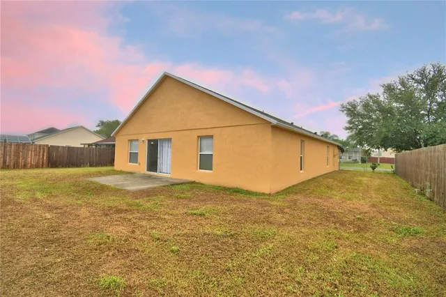 a view of a backyard of the house