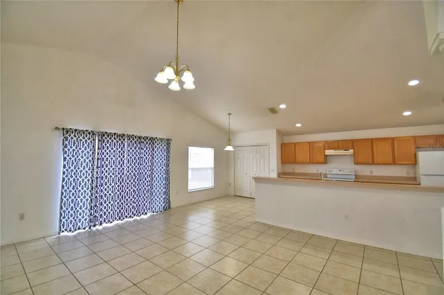 a view of a kitchen with a sink and cabinets