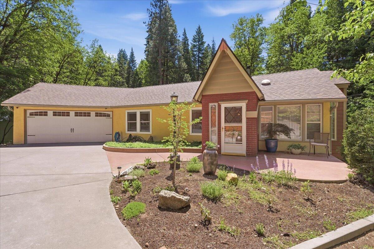 609 Eiler Road Mount Shasta, CA 96067 - Photo 1 of 35 a front view of a house with garden