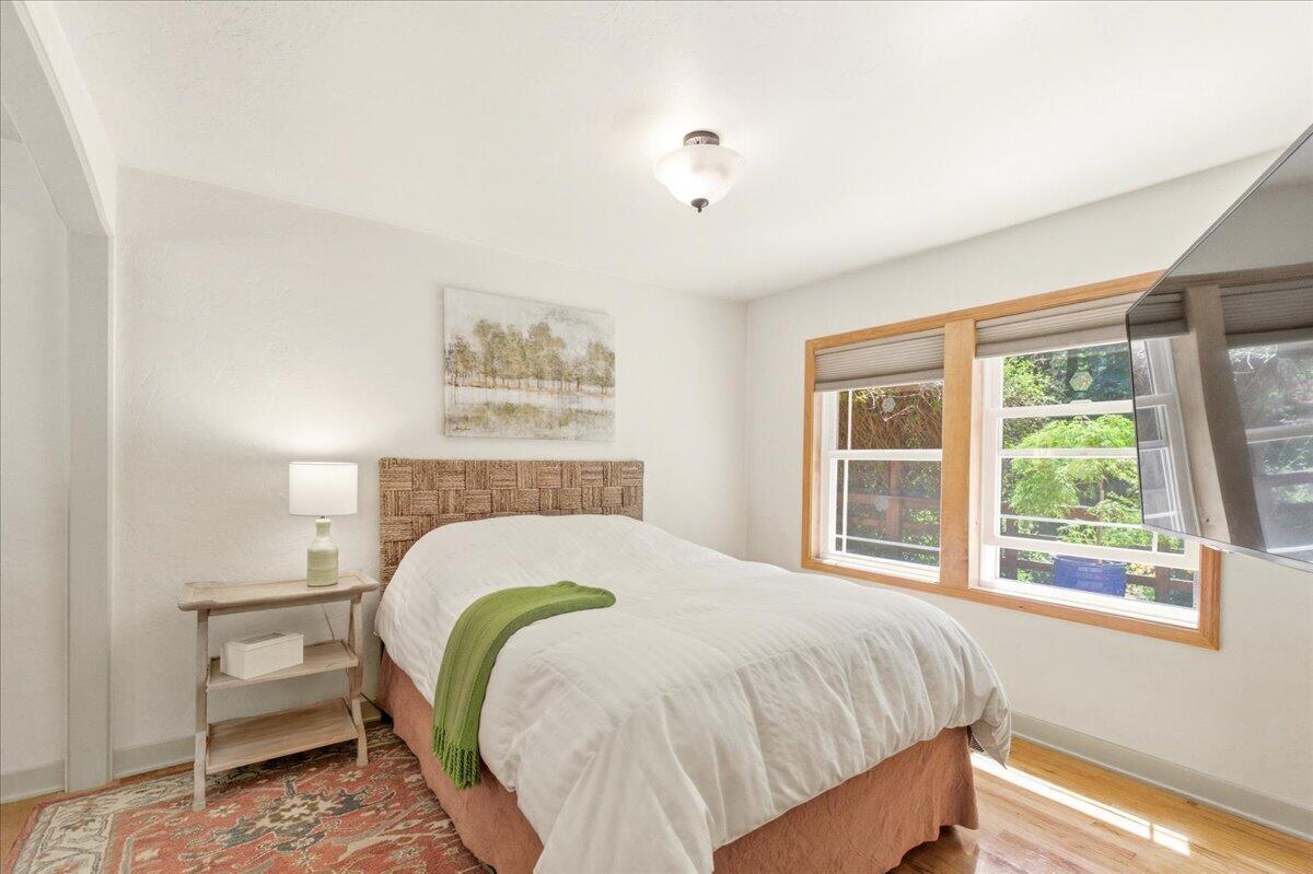 609 Eiler Road Mount Shasta, CA 96067 - Photo 12 of 35 a bed sitting in a bedroom next to a window