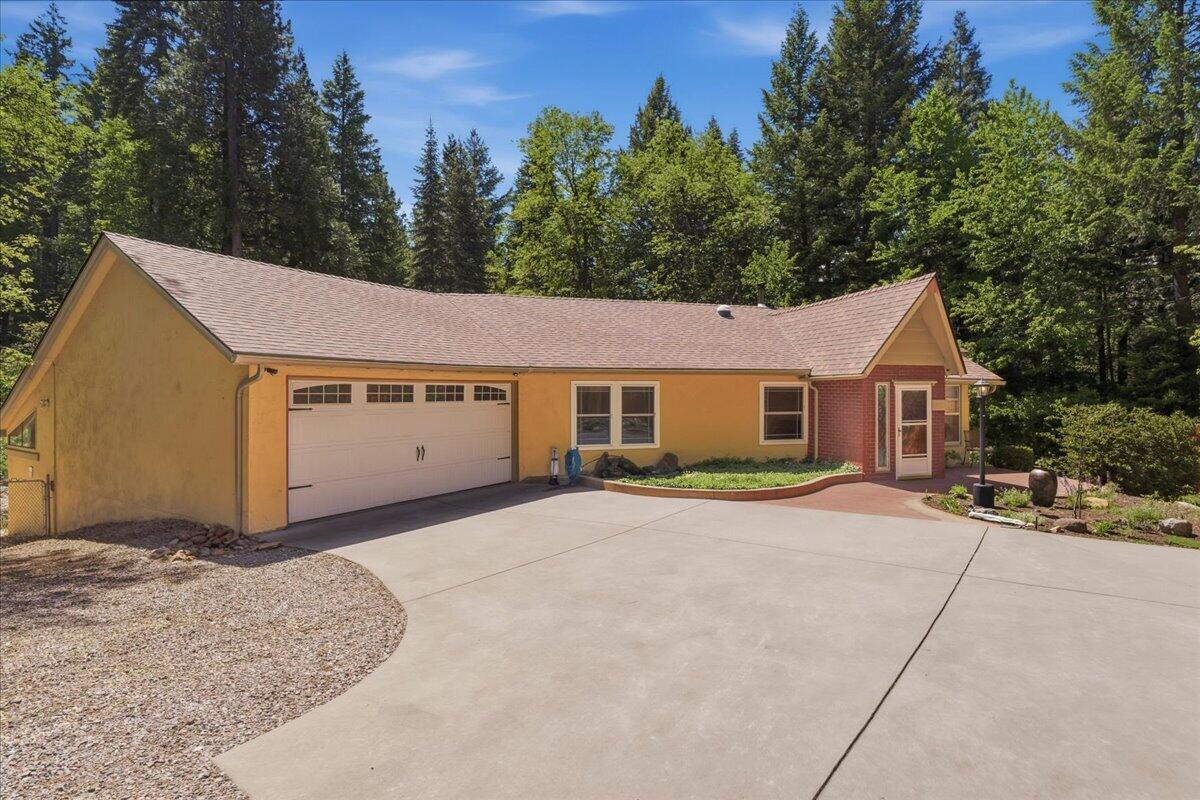 609 Eiler Road Mount Shasta, CA 96067 - Photo 26 of 35 a view of a house with a yard and large trees