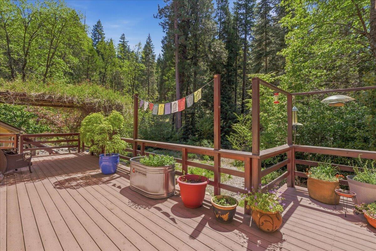 609 Eiler Road Mount Shasta, CA 96067 - Photo 3 of 35 a view of a chairs and table on the wooden deck