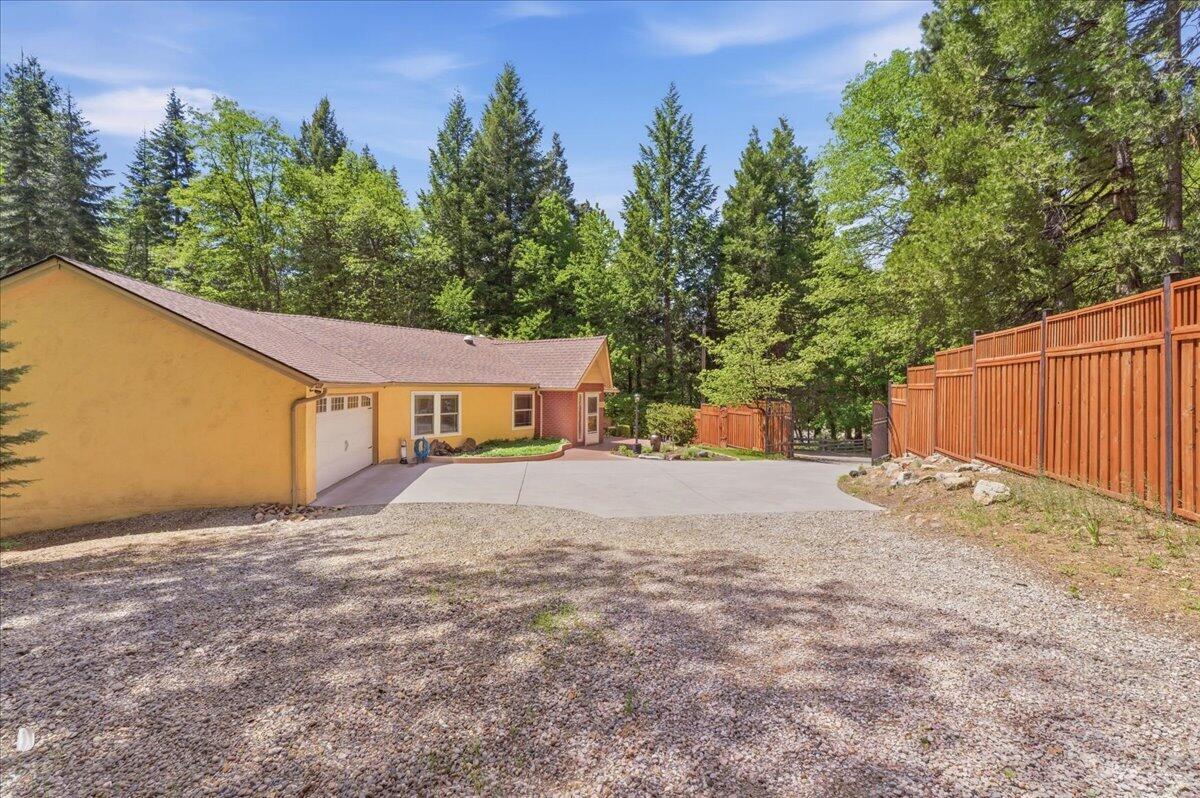 609 Eiler Road Mount Shasta, CA 96067 - Photo 31 of 35 a house with trees in front of it
