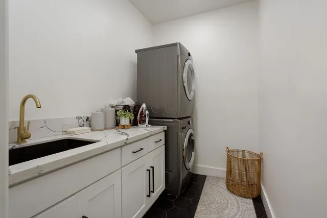 a bathroom with a sink and mirror