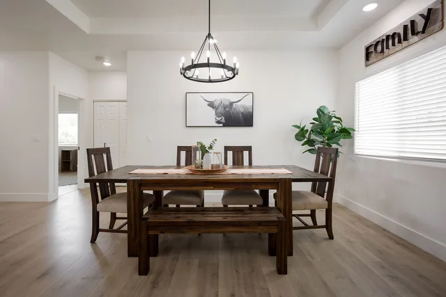 a view of a dining room with furniture window and wooden floor