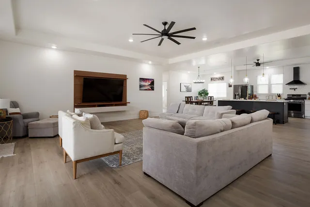 a living room with furniture and a flat screen tv