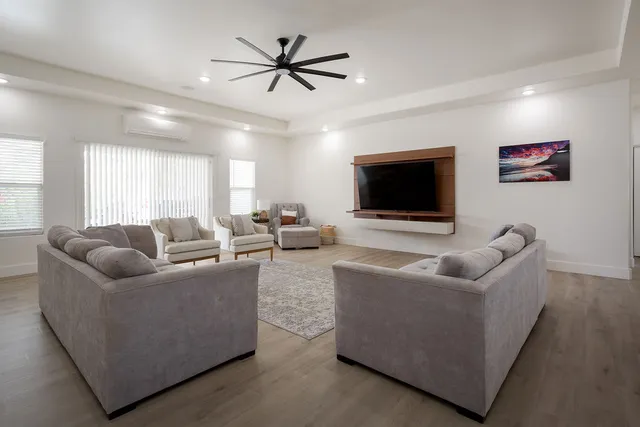 a living room with furniture and a flat screen tv