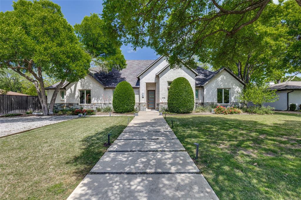 a front view of a house with yard porch and green space