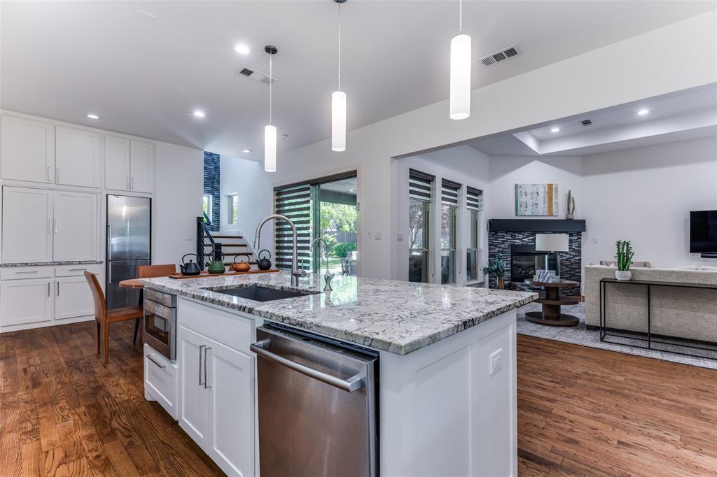 3755 Northview Lane Dallas, TX 75229 - Photo 13 of 36 a kitchen with stainless steel appliances granite countertop a stove and a refrigerator