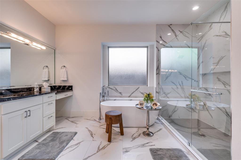 3755 Northview Lane Dallas, TX 75229 - Photo 20 of 36 a spacious bathroom with a granite countertop sink a mirror and a shower