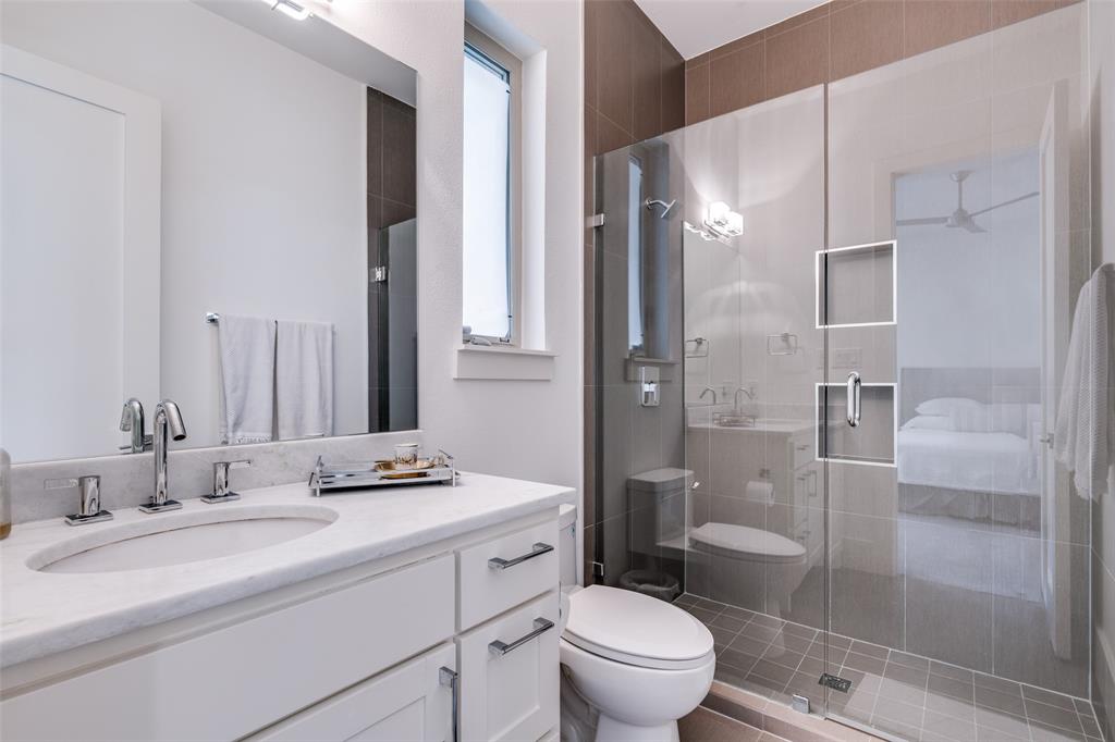 3755 Northview Lane Dallas, TX 75229 - Photo 24 of 36 a bathroom with a granite countertop sink toilet and shower
