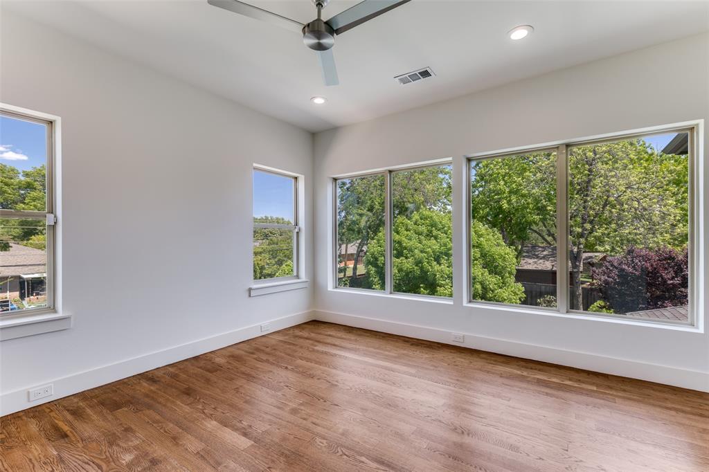 3755 Northview Lane Dallas, TX 75229 - Photo 28 of 36 an empty room with wooden floor and windows