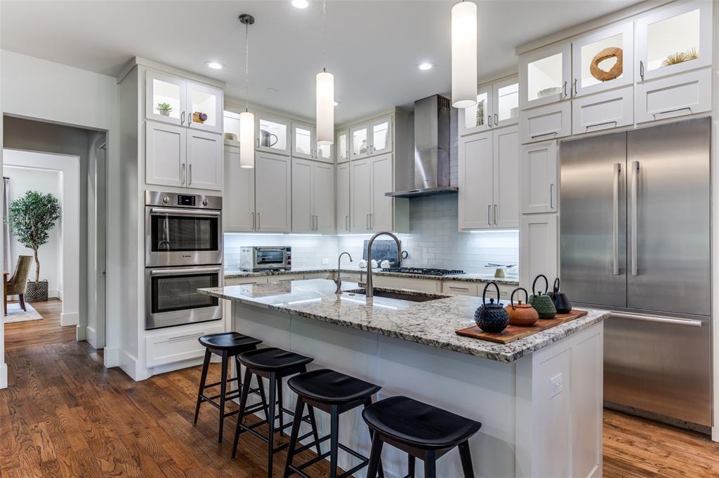 3755 Northview Lane Dallas, TX 75229 - Photo 3 of 36 a kitchen with cabinets and stainless steel appliances