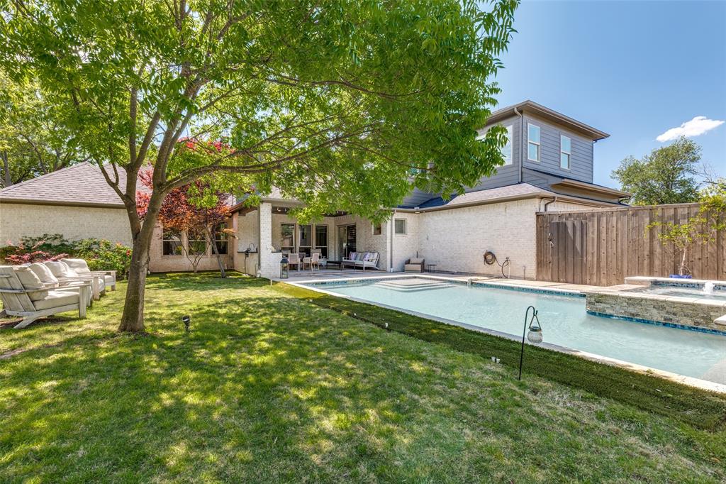 3755 Northview Lane Dallas, TX 75229 - Photo 34 of 36 a view of house with backyard and swimming pool