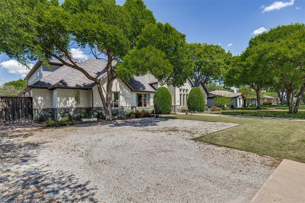 3755 Northview Lane Dallas, TX 75229 - Photo 36 of 36 a front view of a house with a yard and trees