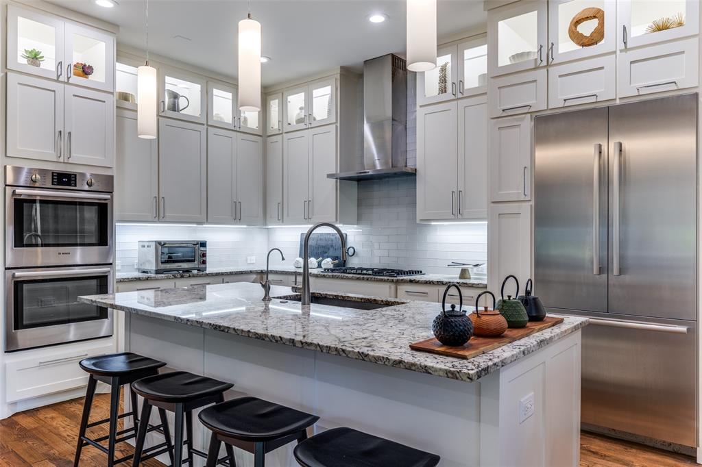 3755 Northview Lane Dallas, TX 75229 - Photo 10 of 36 a kitchen with stainless steel appliances a sink a stove and cabinets