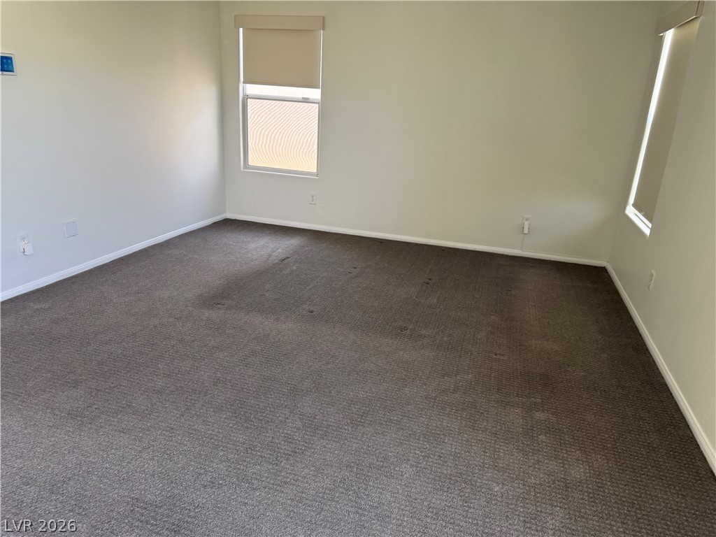 1141 Cathedral Ridge Street Henderson, NV 89052 - Photo 43 of 77 This versatile room features carpet flooring and ample natural light, perfect for any use.