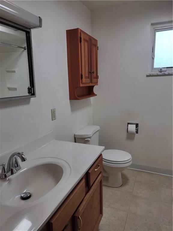 196 Valley Road Eighty Four, PA 15330 - Photo 12 of 16 a bathroom with a toilet sink and mirror