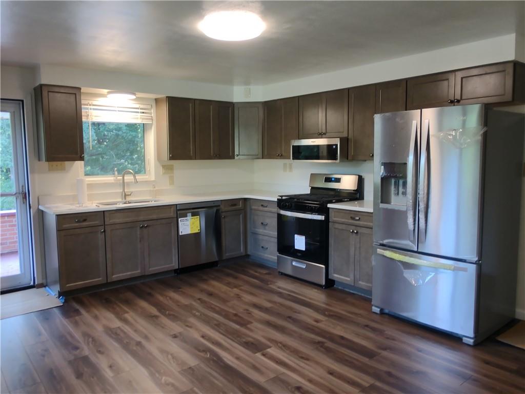 196 Valley Road Eighty Four, PA 15330 - Photo 4 of 16 a kitchen with stainless steel appliances granite countertop a refrigerator a sink dishwasher a stove and a refrigerator