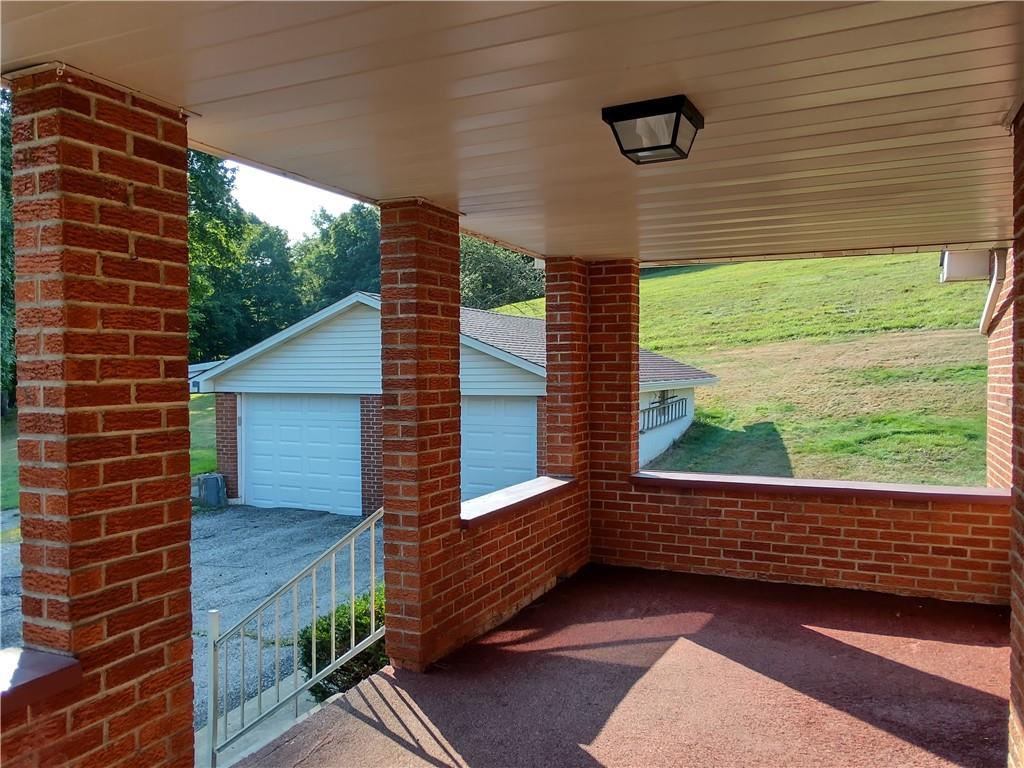 196 Valley Road Eighty Four, PA 15330 - Photo 6 of 16 a view of a porch with wooden floor and a yard