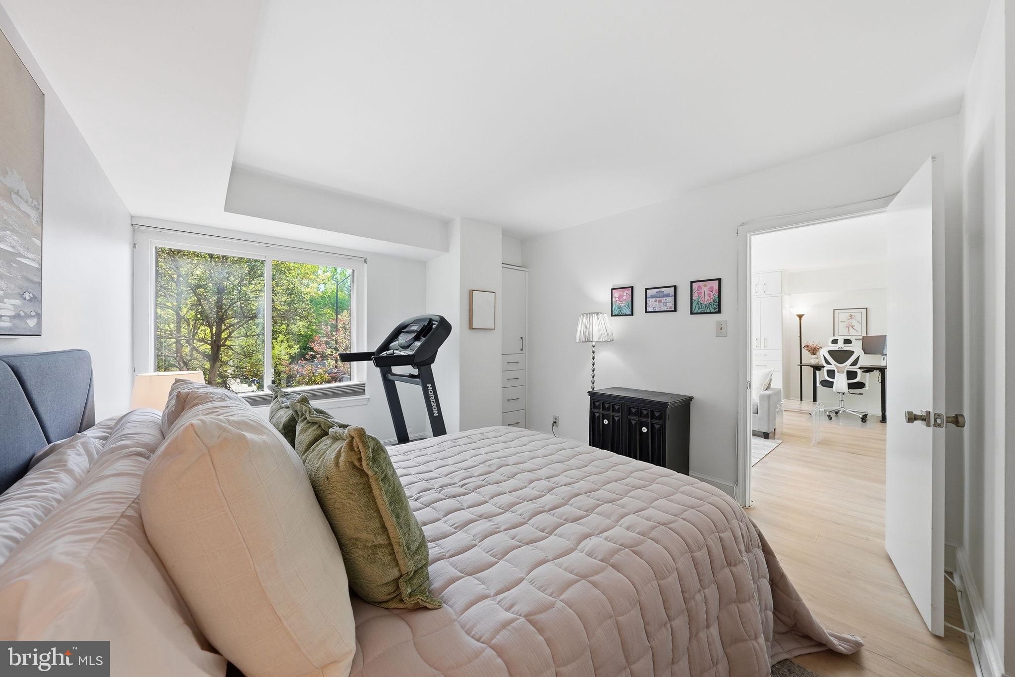1825 T Street Northwest, Unit 207 Washington, DC 20009 - Photo 15 of 22 a bed room with a bed and a large window