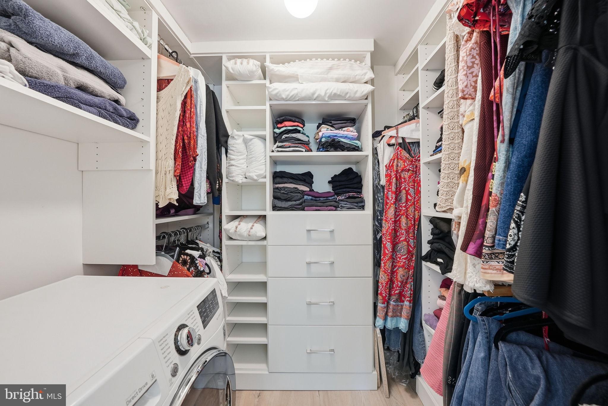 1825 T Street Northwest, Unit 207 Washington, DC 20009 - Photo 16 of 22 a view of walk in closet with clothes and shoes