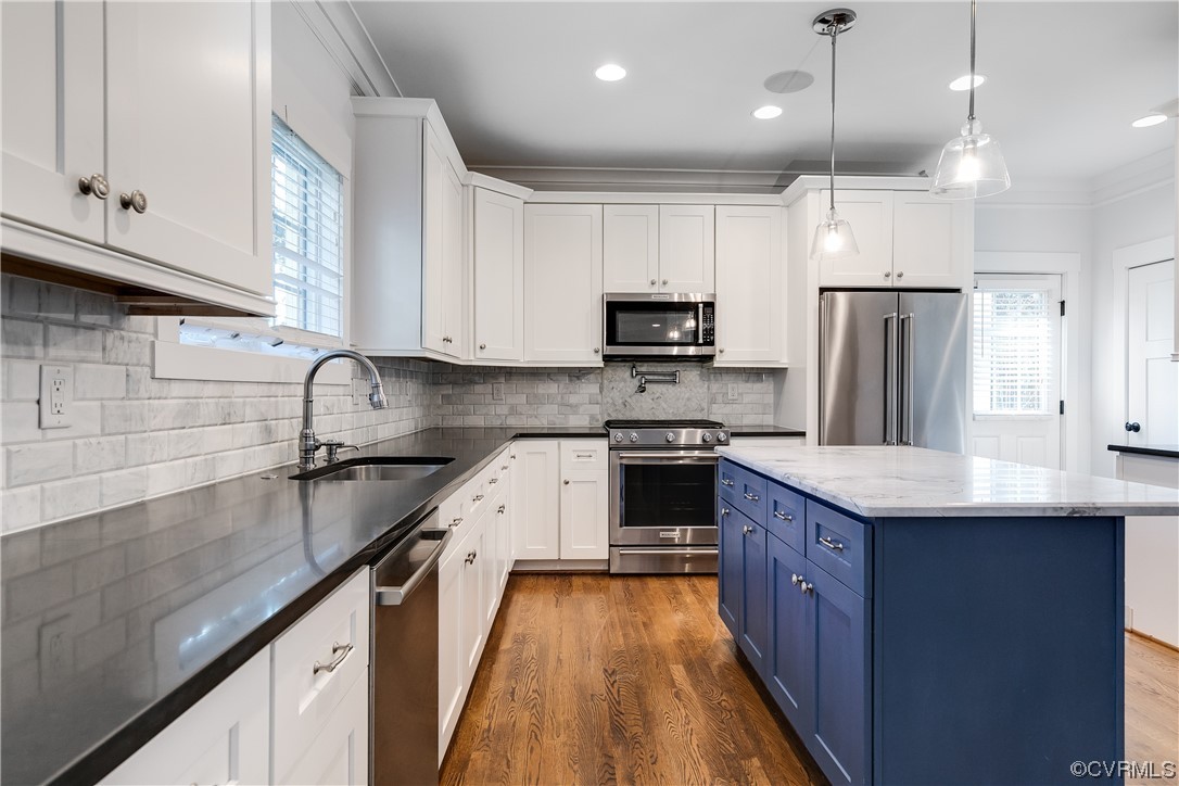 7203 Pinetree Road Henrico, VA 23229 - Photo 15 of 50 a kitchen with kitchen island granite countertop stainless steel appliances cabinets a sink and a stove