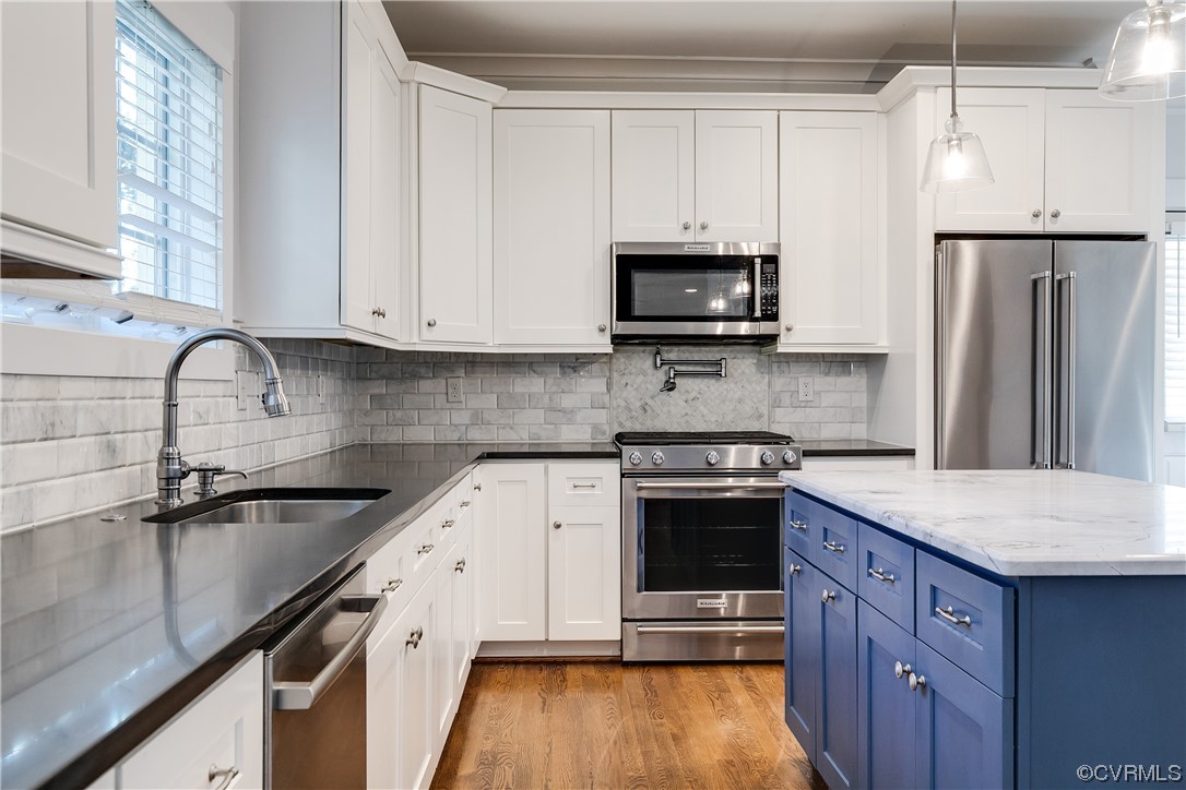 7203 Pinetree Road Henrico, VA 23229 - Photo 16 of 50 a kitchen with stainless steel appliances granite countertop a sink stove and refrigerator