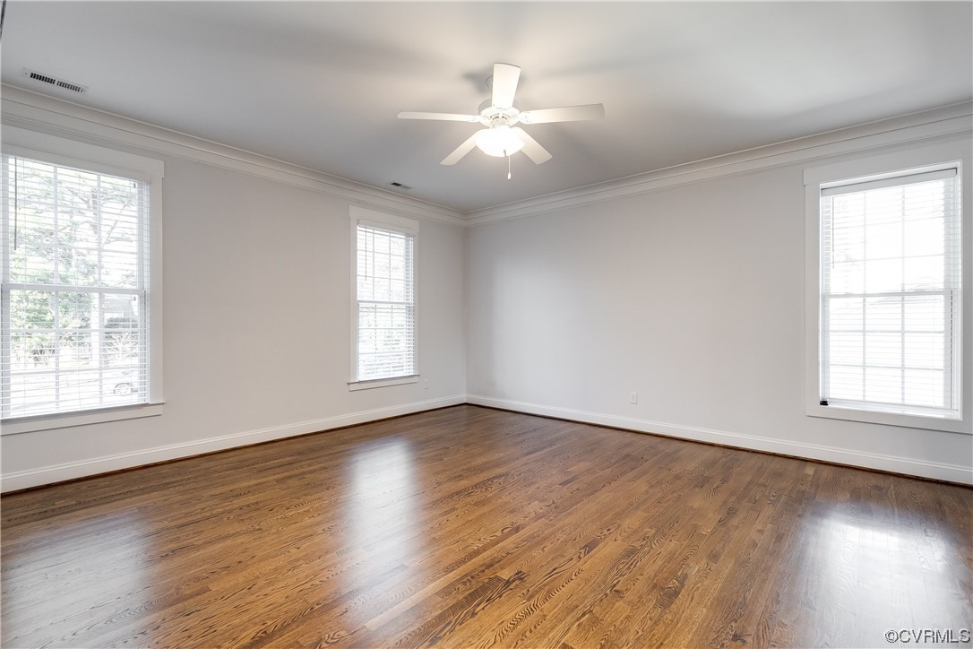 7203 Pinetree Road Henrico, VA 23229 - Photo 31 of 50 an empty room with wooden floor and windows