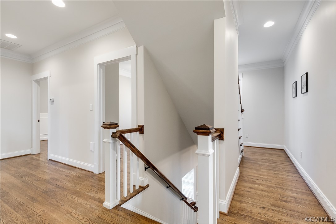 7203 Pinetree Road Henrico, VA 23229 - Photo 38 of 50 a view of a hallway with wooden floor and staircase