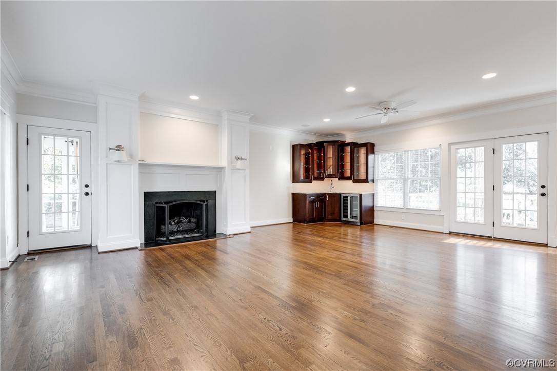 7203 Pinetree Road Henrico, VA 23229 - Photo 4 of 50 a view of an empty room with window and wooden floor
