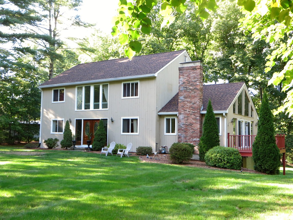 24 Raynor Road Sudbury, MA 01776 - Photo 1 of 30 a front view of a house with a garden