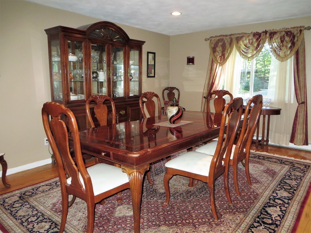 24 Raynor Road Sudbury, MA 01776 - Photo 11 of 30 a view of a dining room with furniture window and outside view
