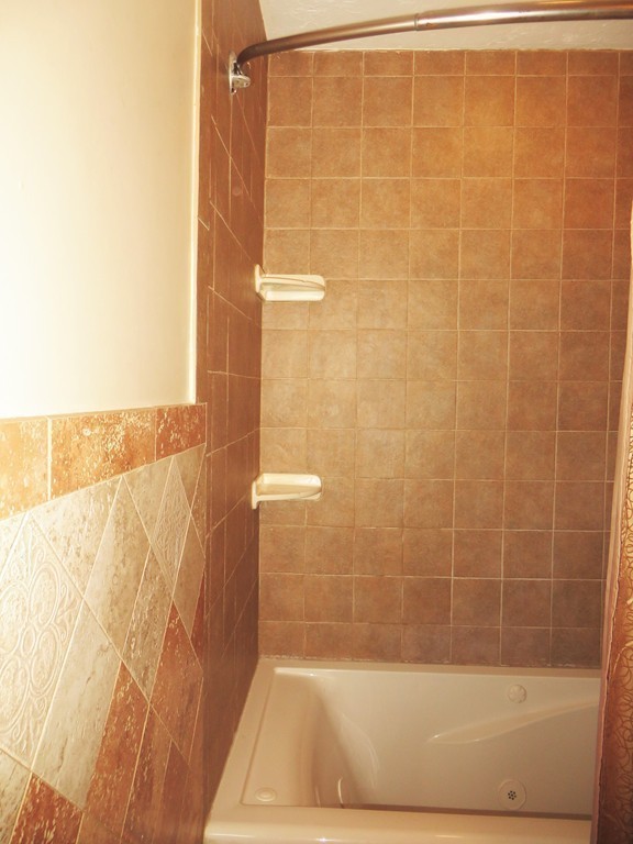 24 Raynor Road Sudbury, MA 01776 - Photo 16 of 30 a bathroom with a shower