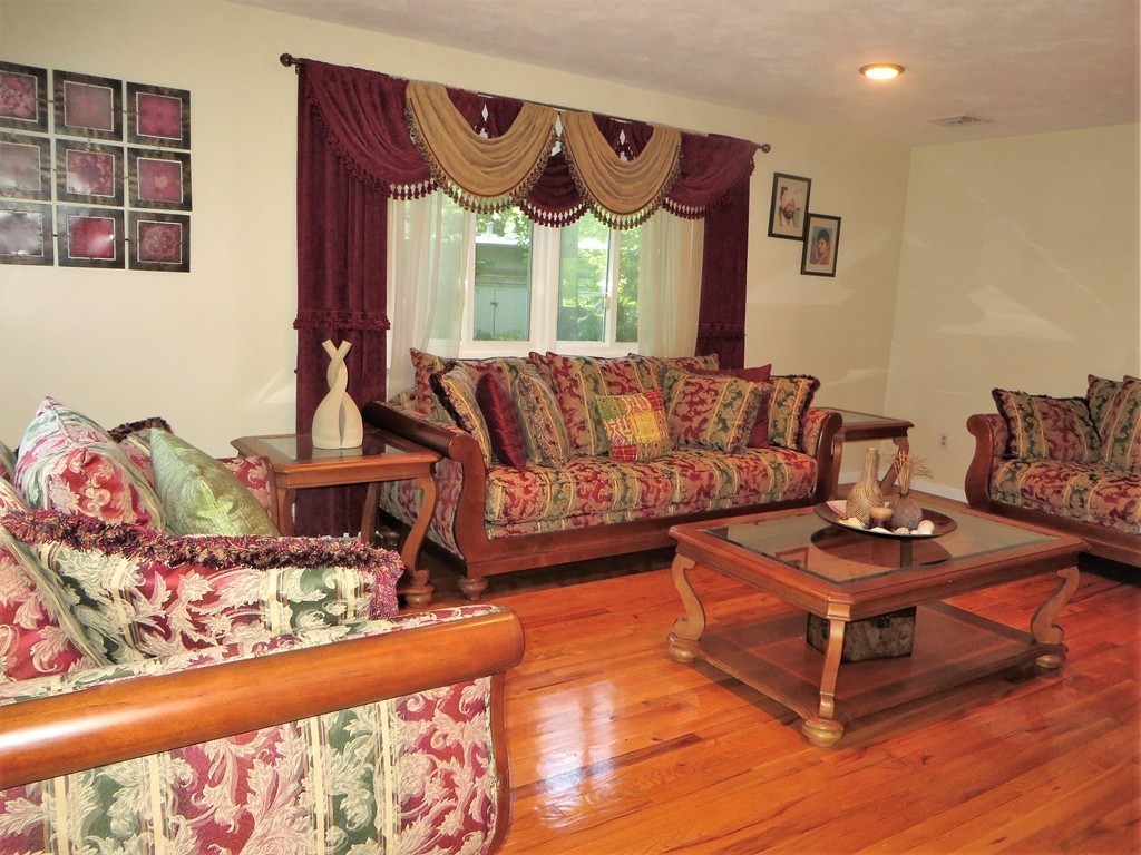 24 Raynor Road Sudbury, MA 01776 - Photo 23 of 30 a living room with furniture and a wooden floor