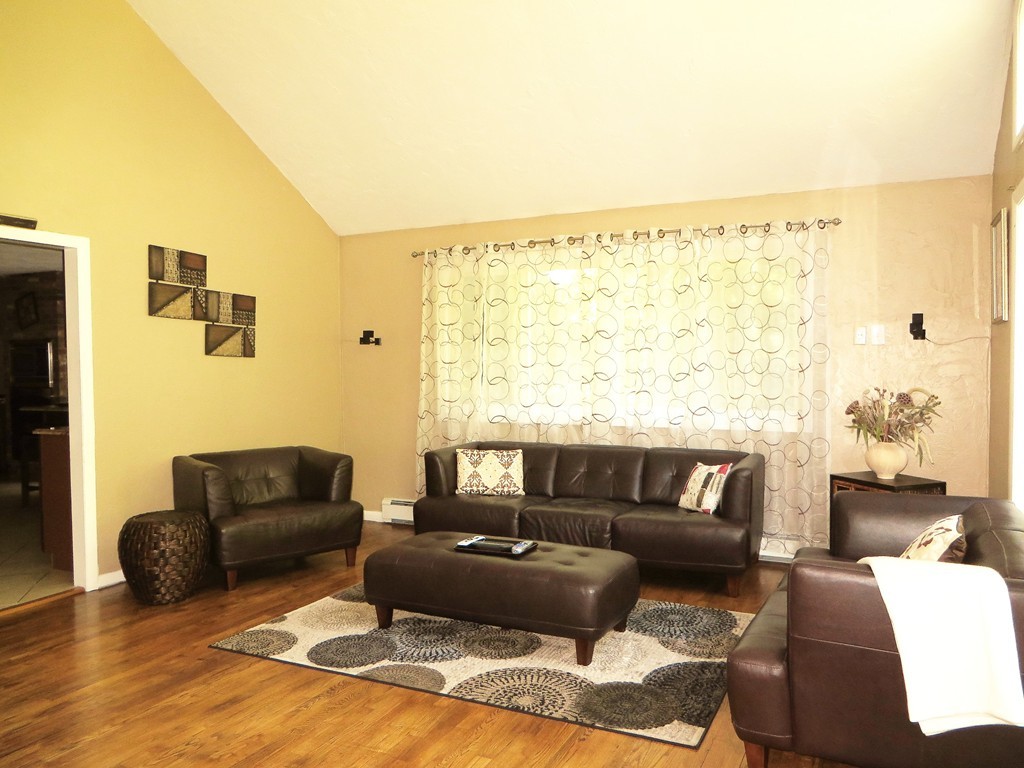 24 Raynor Road Sudbury, MA 01776 - Photo 26 of 30 a living room with furniture and a large window