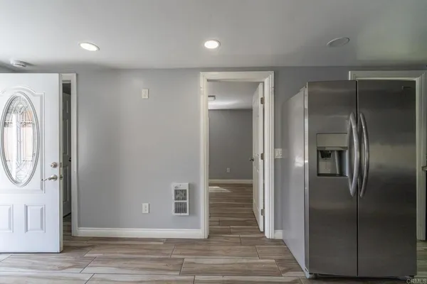 a bathroom with a toilet a sink a mirror and a shower