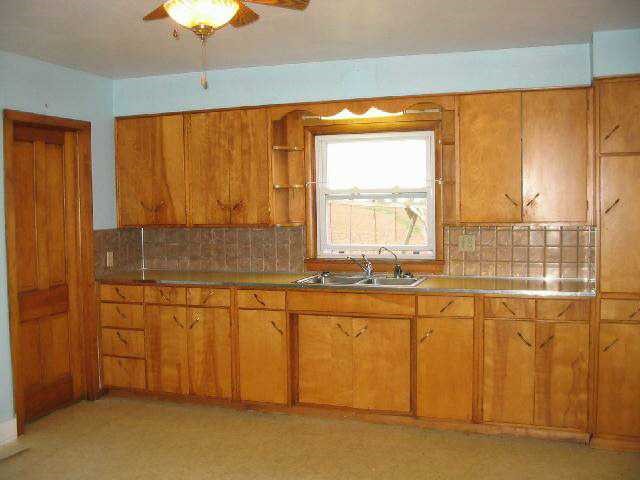 20694 Timberlake Road Chadwick, IL 61014 - Photo 4 of 9 a view of a kitchen with a sink and cabinets