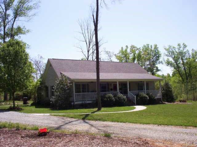 230 Charlie Moore Road Timberlake, NC 27583 - Photo 1 of 1 a front view of a house with a yard