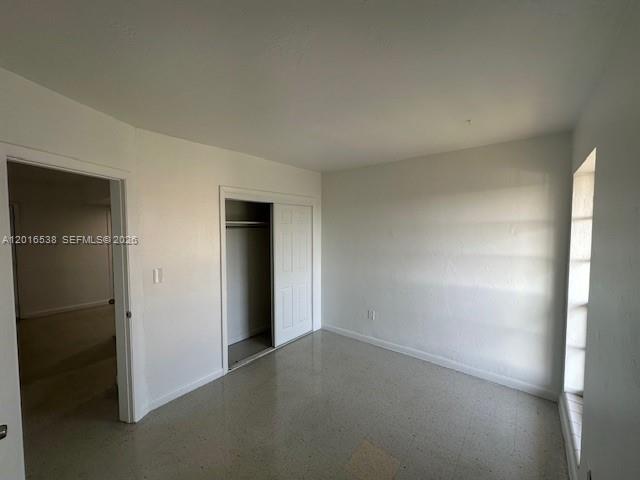 1400 Douglas Road, Unit 14 Coral Gables, FL 33134 - Photo 11 of 19 an empty room with closet