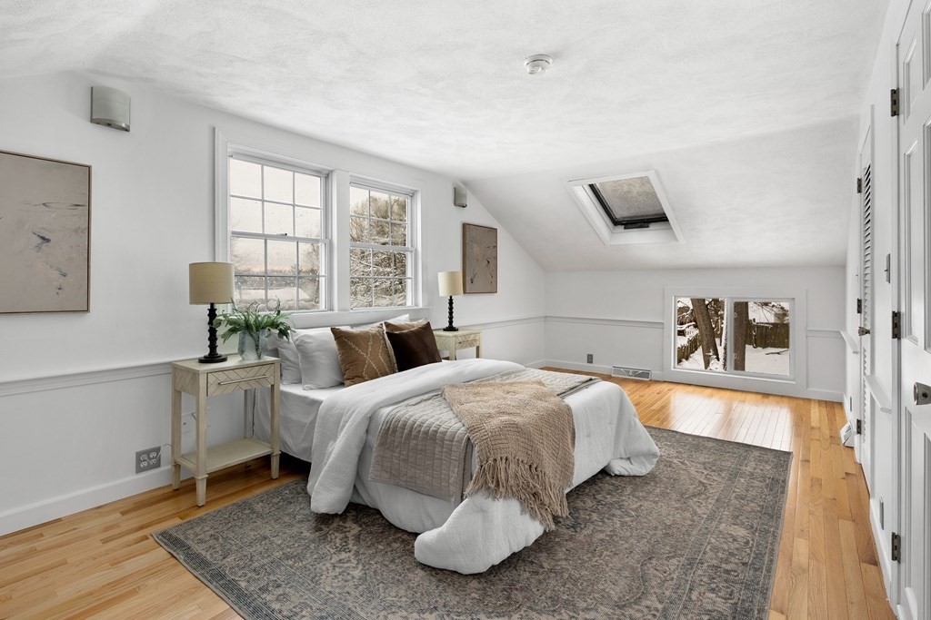 9 Fuller Road Billerica, MA 01821 - Photo 15 of 27 a bedroom with a bed and wooden floor