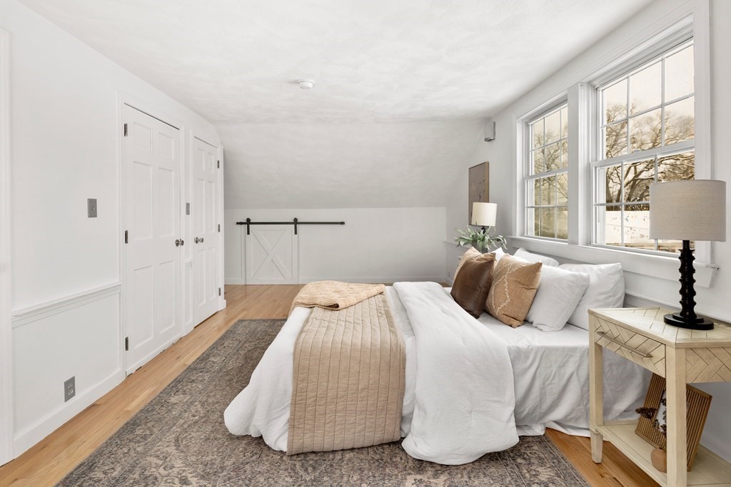 9 Fuller Road Billerica, MA 01821 - Photo 16 of 27 a bedroom with a bed and a large window