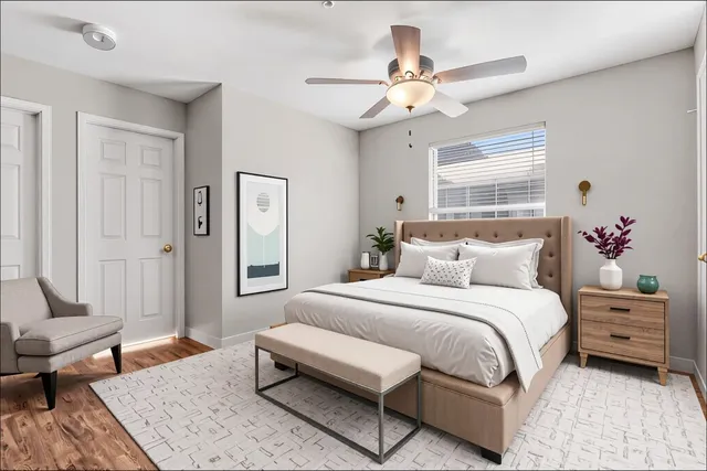 a bedroom with a bed couch and window