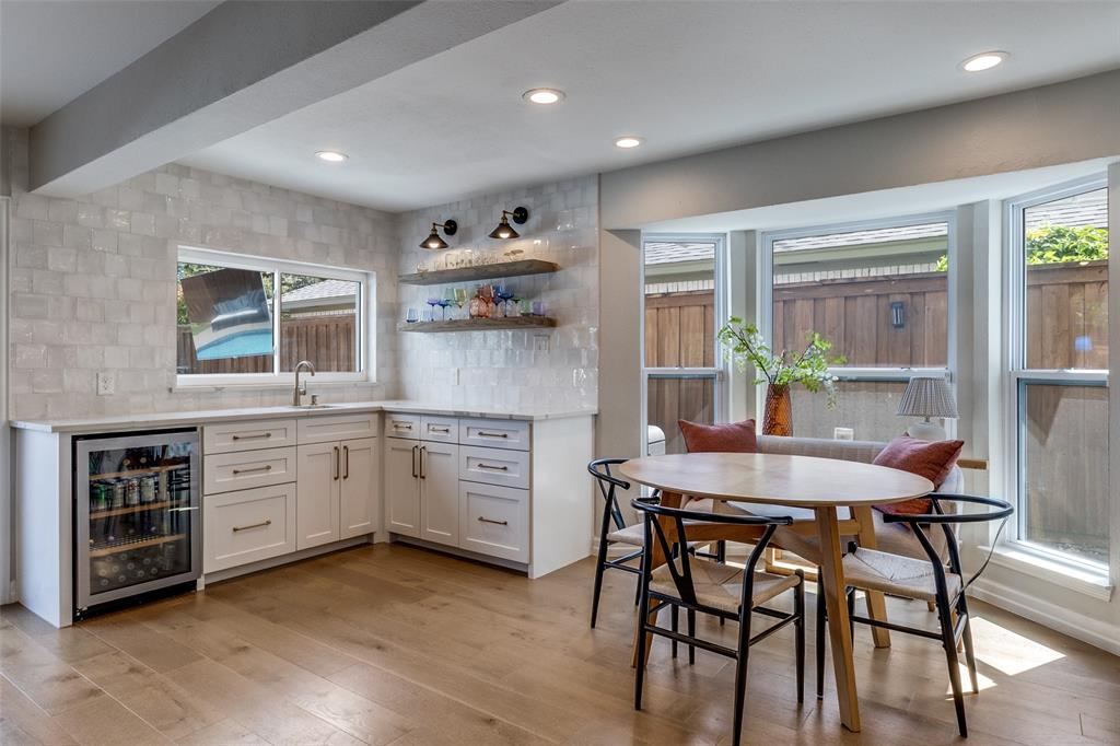9243 Moss Farm Lane Dallas, TX 75243 - Photo 13 of 37 a kitchen with a table and chairs in it