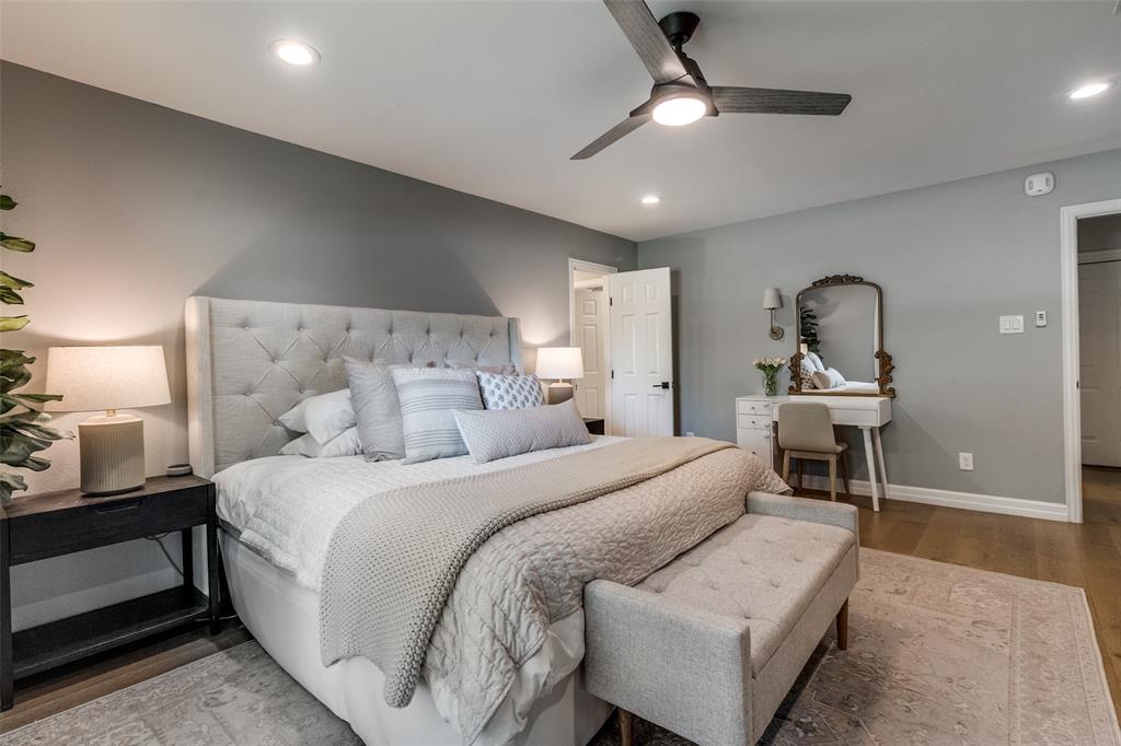 9243 Moss Farm Lane Dallas, TX 75243 - Photo 18 of 37 a bedroom with a bed and a lamp with the dresser