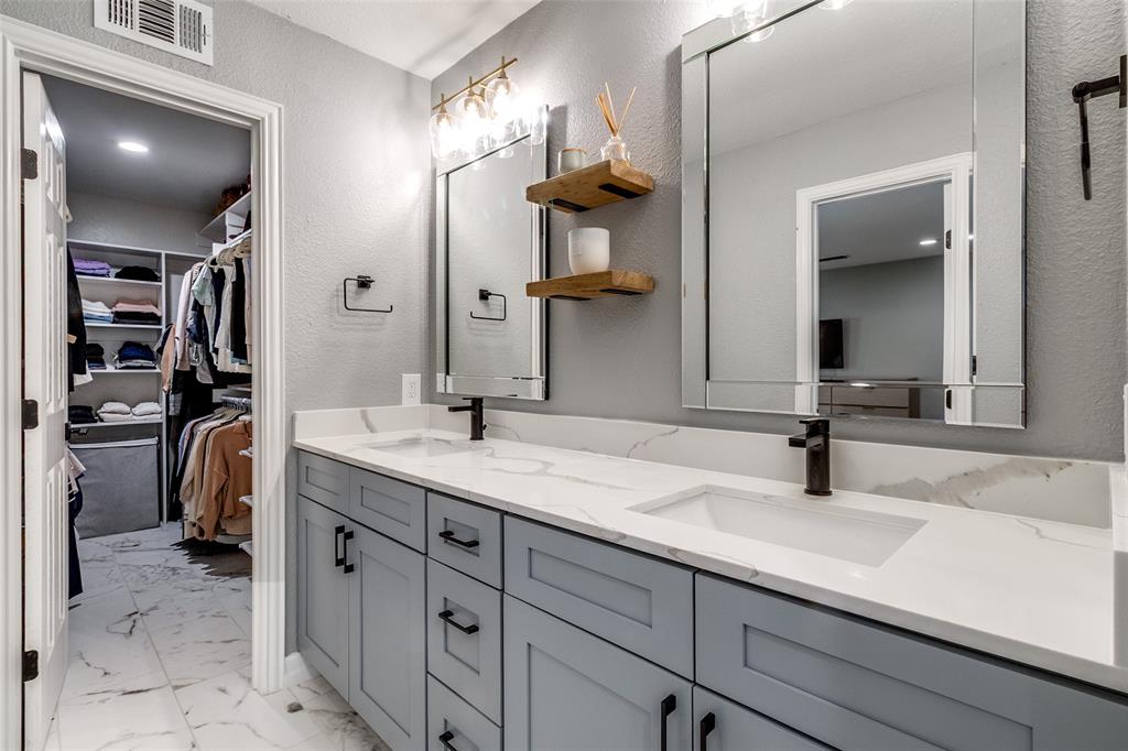 9243 Moss Farm Lane Dallas, TX 75243 - Photo 20 of 37 a bathroom with a sink double vanity