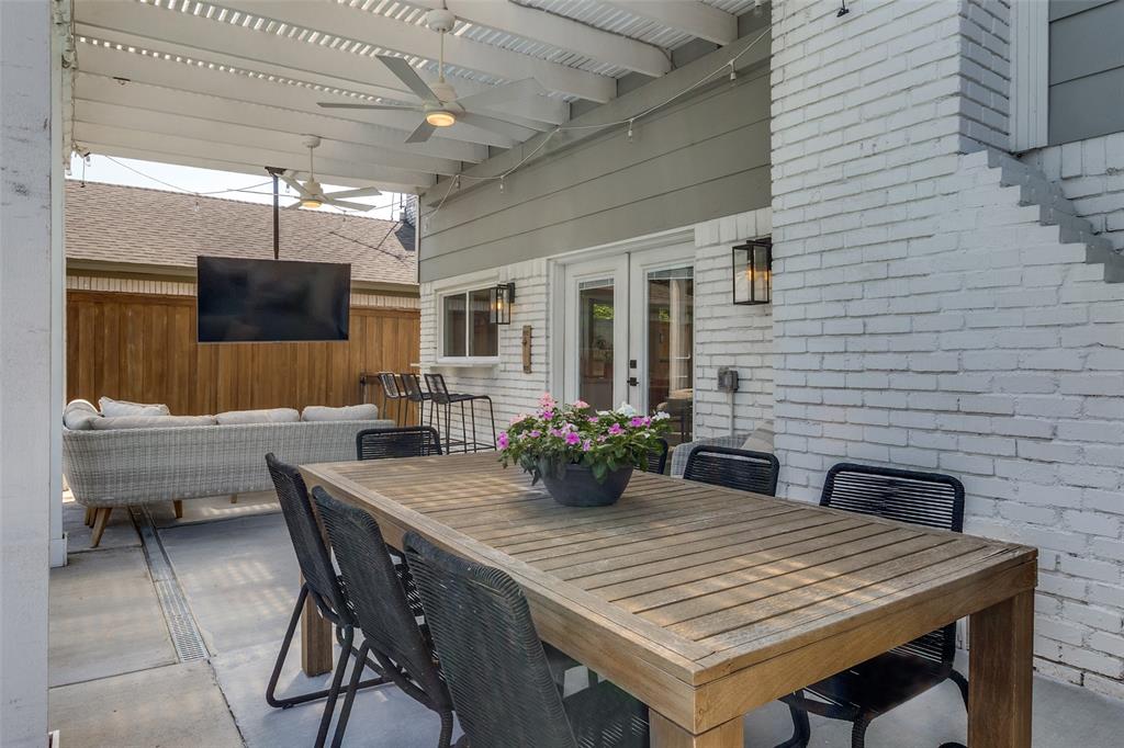 9243 Moss Farm Lane Dallas, TX 75243 - Photo 28 of 37 a view of a dining table and chairs in the patio