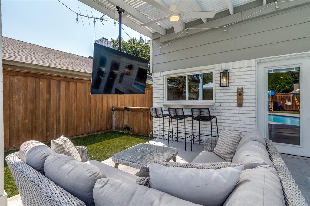 9243 Moss Farm Lane Dallas, TX 75243 - Photo 29 of 37 a living room with furniture window and wall painting