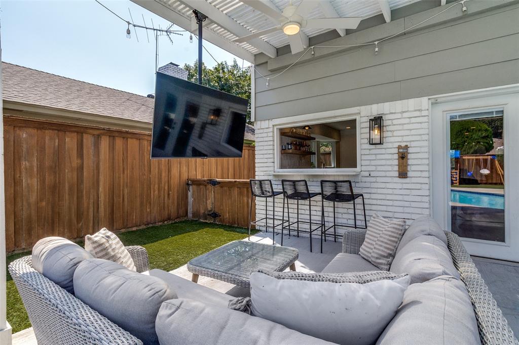 9243 Moss Farm Lane Dallas, TX 75243 - Photo 30 of 37 a living room with furniture window and flat screen tv