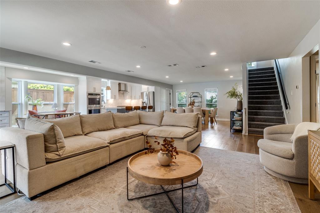 9243 Moss Farm Lane Dallas, TX 75243 - Photo 3 of 37 a living room with furniture and a wooden floor